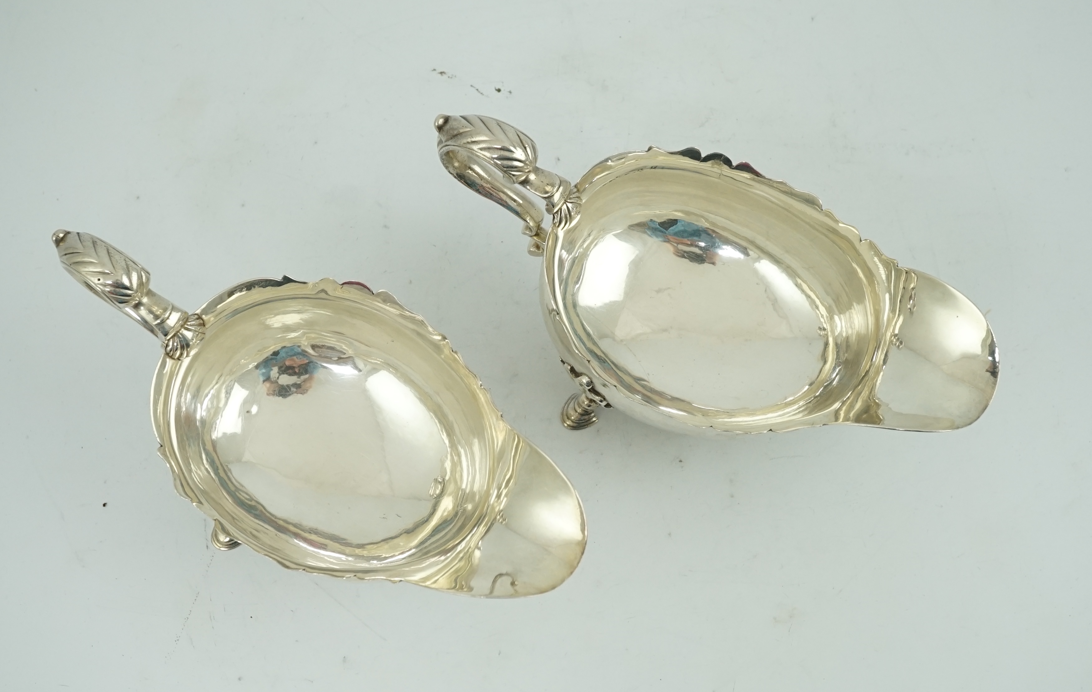 A pair of late George II silver sauceboats by Robert Albin Cox